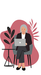 Elderly woman with gray hair confidently using a laptop while seated in a modern chair, illustrating senior digital engagement, remote work, or comfortable online learning.