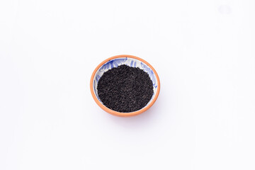Bowl with Black Seeds (Nigella Sativa) Isolated on White background