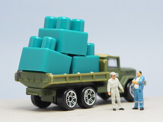 Mini toy of action figure with blurred background. Miniature photography concept design. Minifigure...