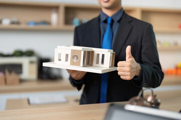 Architectural Model Presentation. Professional agent showcasing design to client.
