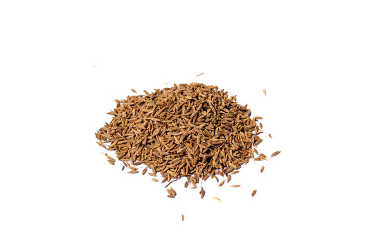 Brown Cumin Seeds Jeera Spice Heap on White Background.