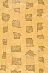 The lattice top crust of an unbaked apple pie, revealing glimpses of the apple filling beneath,...
