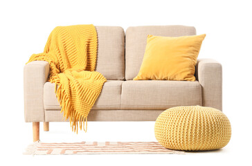 Modern beige sofa and pouf isolated on white background, closeup