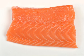 A detailed close-up of a single raw salmon fillet portion, highlighting the rich orange color and natural texture of the fresh fish