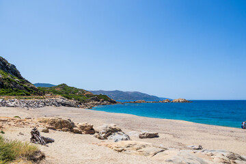 Sandy beach with turquoise sea and rocky coast France Corsica 18 June 2025