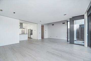 Void living room with an integrated home automation system, underfloor heating, and automated lighting control