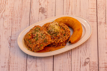 Northern-style mostrito with beef marinated in chicha de jora, a fried egg, and fried sweet potato...