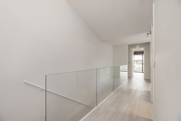 Hallway railing with silkscreened glass and a satin-finish aluminum structure