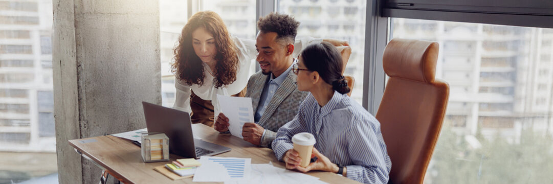 A diverse team is strategically collaborating on data and analytics in a stylish office, brainstorming creatively - Powered by Adobe