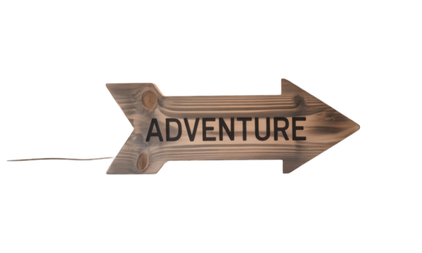 Wooden arrow sign reading "ADVENTURE", mounted on dark background