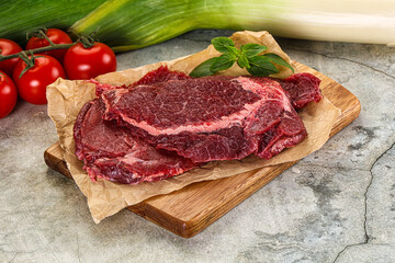 Raw beef cheeks cut for cooking