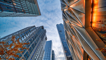 New York City - June 13, 2025: Wide view of Manhattan’s Hudson Yards towers glowing against the...