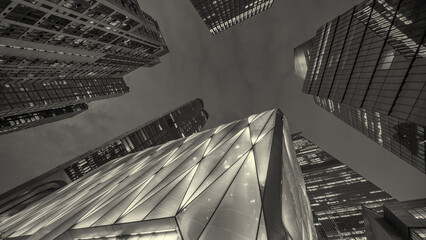 Low-angle shot of Manhattan’s Hudson Yards buildings at night highlighting towering modern architecture
