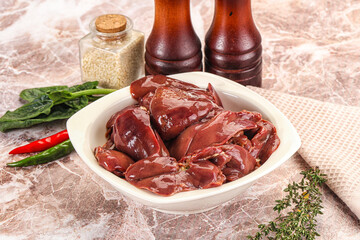 Raw uncokked chicken liver in the bowl