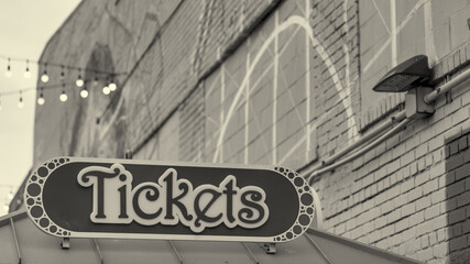 Close-up of the “Tickets” sign at Coney Island amusement park entrance