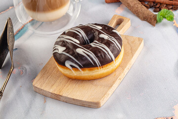 Delicous sweet donut with chocolate glaze