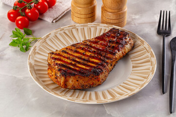 Grilled pork steak with bone