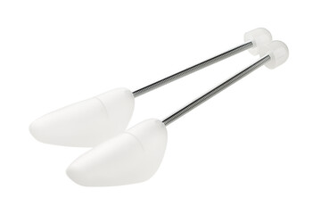 White plastic shoe stretcher and shoe storage insert. Shoe care.