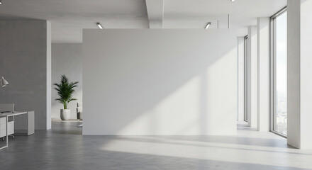 Obraz premium Bright, minimalist office interior with large windows and a blank white wall.