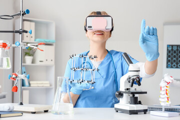 Female doctor using VR glasses with molecular model at table in clinic