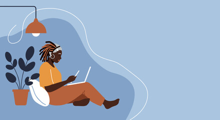 An African American woman comfortably works or studies from home using a laptop and phone. Ideal for themes of remote work, technology, and modern lifestyle.