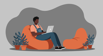 Man working comfortably on a laptop in a relaxed, modern home or office setting. Represents remote work, casual productivity, or flexible lifestyle.