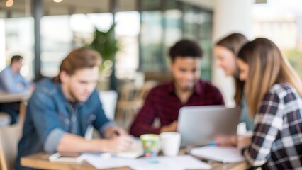 Young creative professionals gathered at office table &mdash; collaborating on fresh business ideas