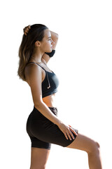 A young slim athletic girl in sportswear performs a set of exercises. Fitness and healthy lifestyle.