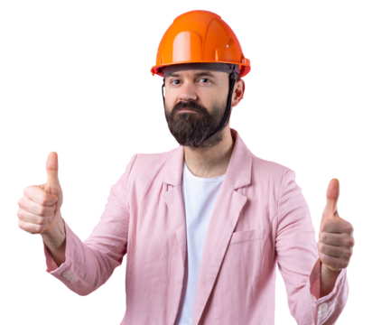 Portrait of young construction engineer wear orange hard hat, in a pink jacket standing on red studio background. The man points with his hand.