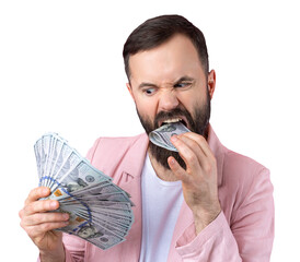 Portrait of a contented young businessman with a beard dressed in a pink jacket showing us dollar banknotes against a red studio background. Taste, smell of money.