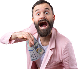 Portrait of a contented young businessman with a beard dressed in a pink jacket showing us dollar banknotes against a red studio background. Taste, smell of money.