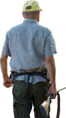 Hunter man in camouflage with a gun during the hunt in search of wild birds or game.