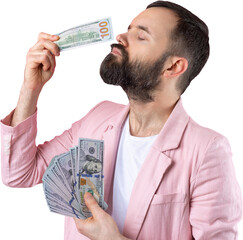Portrait of a contented young businessman with a beard dressed in a pink jacket showing us dollar banknotes against a red studio background. Taste, smell of money.