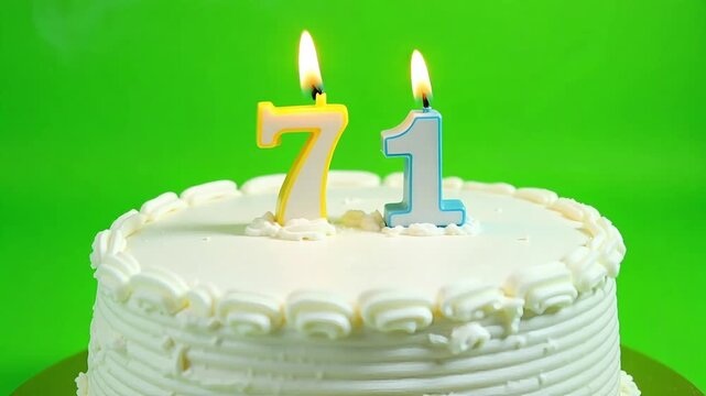 Celebrate milestone birthday with festive cake and lit candles, marking 71 years of joy and memories, perfect for anniversaries and special events.