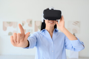 Young woman using VR glasses in modern art gallery, closeup