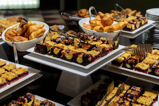 A delicious dessert and pastry buffet with a variety of cakes, brownies, and croissants. Perfect for a corporate event, hotel breakfast, or celebration.