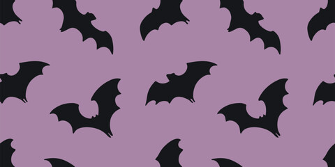 Seamless Halloween vector pattern with black bats flying on a purple background. Eerie and playful design ideal for spooky party decorations, fabrics, and digital use