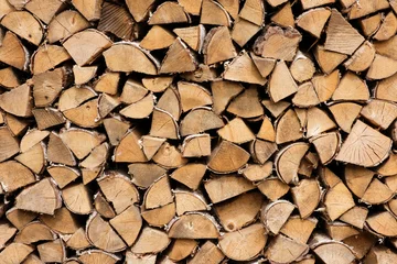 Fotobehang Brandhout A pile of wood logs with a lot of different sizes  © Pawel