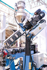 Industrial machinery for manufacturing. Plastic recycling equipment in factories or warehouses. High tech production line concept.