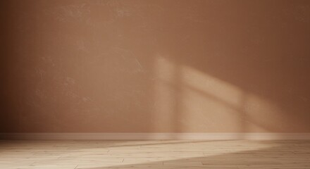 Warm terracotta textured wall with soft, angled sunlight casting shadows on a light wood floor