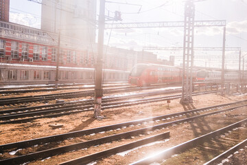 A train is traveling down a track in a city