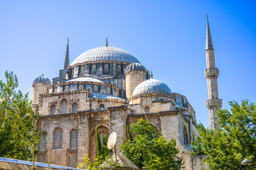 Sehzade Mosque with Domes and Minarets Framed by Garden Arch in Istanbul