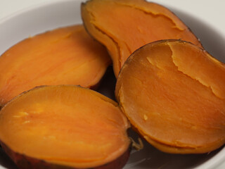 Steamed sweet potatoes on white background