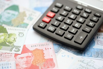 Pakistan rupees banknotes and calculator. The current Pakistan money bills with calculator