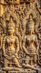 Fototapeta premium Close-up of ancient Khmer carvings depicting mythological scenes on temple walls