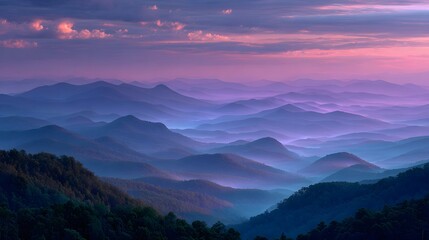Fototapeta premium Breathtaking panoramic photograph of the Blue Ridge Mountains at dawn, with layers of hills fading into shades of blue and purple under a sky.