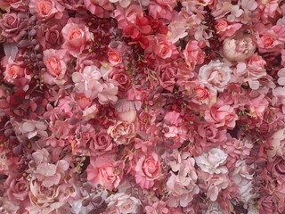 Selective focus of multi colour of artificial roses flowers backdrop, Mixed colourful texture