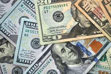 Big amount of different dollar bills close up. Hundred fifty twenty ten and five dollar banknotes