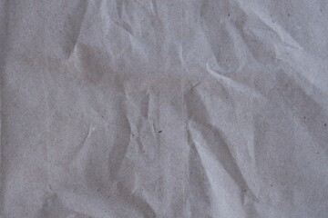 Brown crumpled recycled paper texture background. Kraft Paper