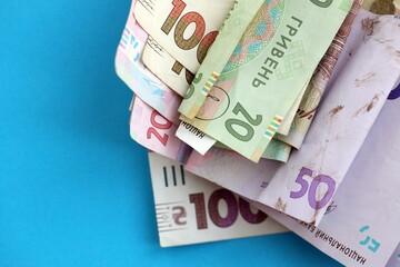 Big amount of different Ukrainian hryvnia money bills. Pile of crumpled ukrainian banknotes